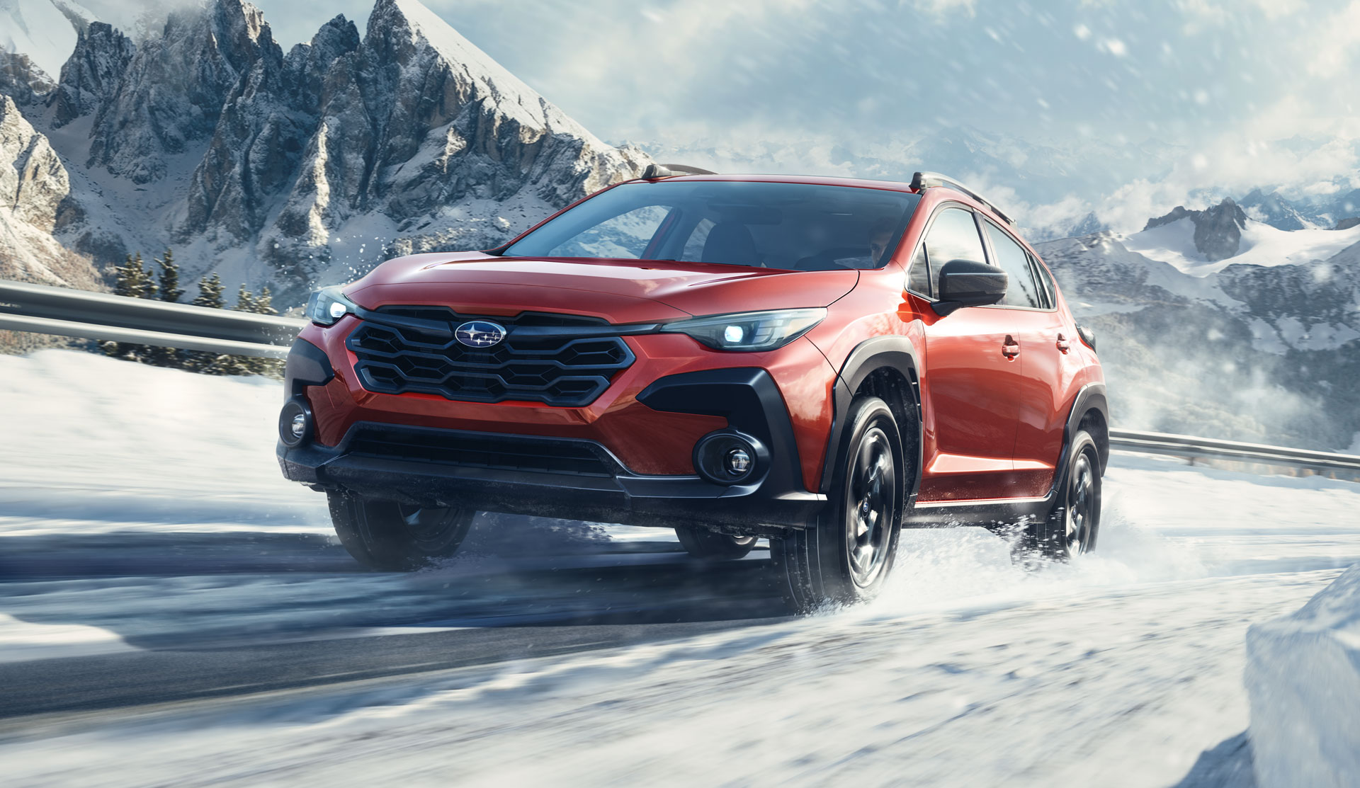 2024 Crosstrek with bicycles on roof, driving on the road.